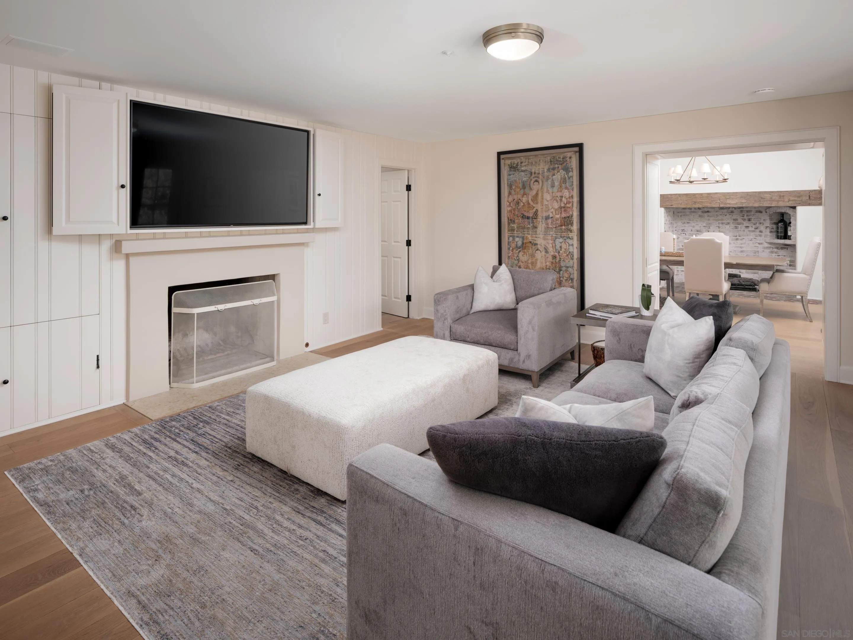 6502 Via Vista Canada Rancho Santa Fe, CA 92067 - Photo 12 of 55 a living room with couches a fireplace and a flat screen tv