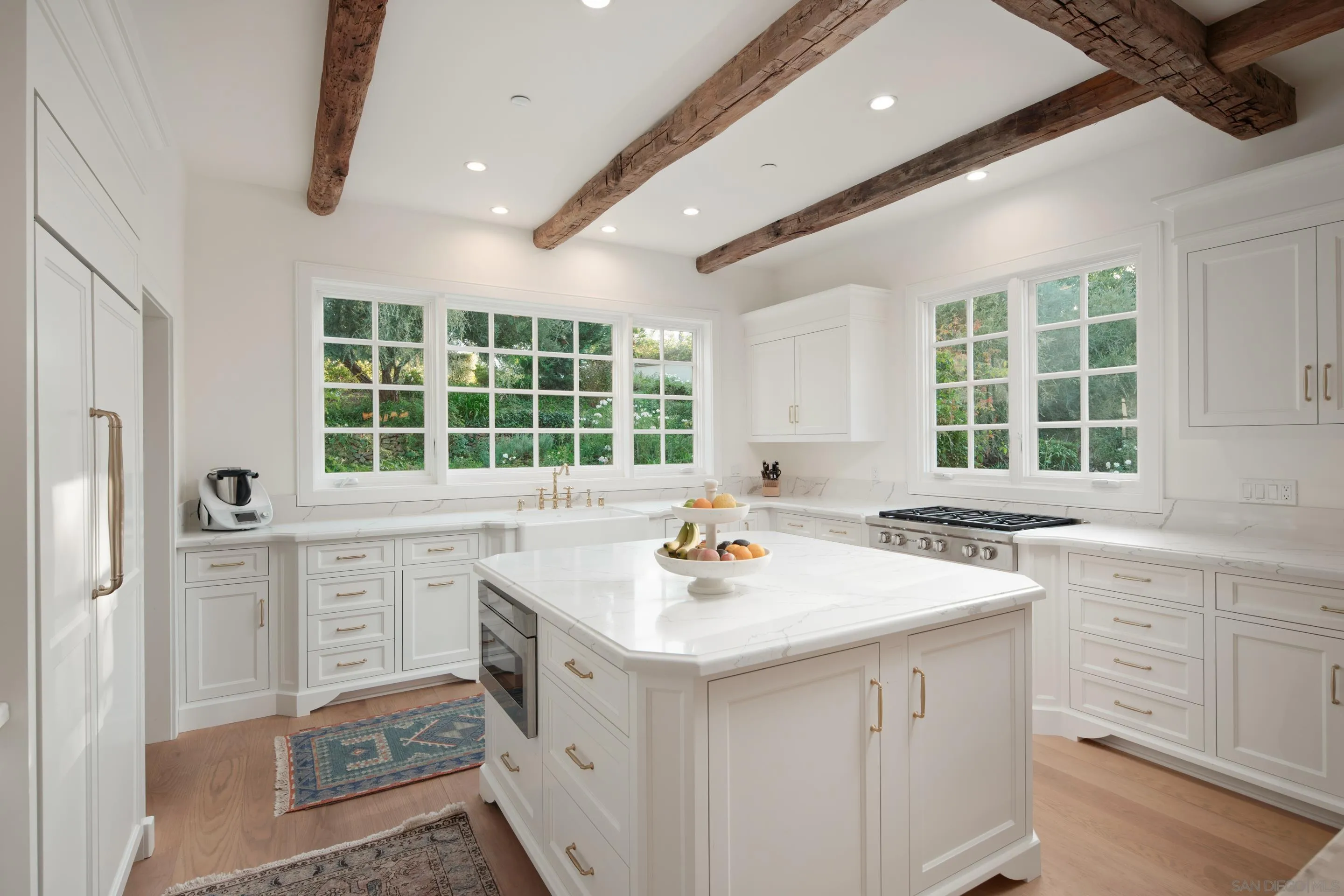 6502 Via Vista Canada Rancho Santa Fe, CA 92067 - Photo 15 of 55 a kitchen with a sink stove and cabinets