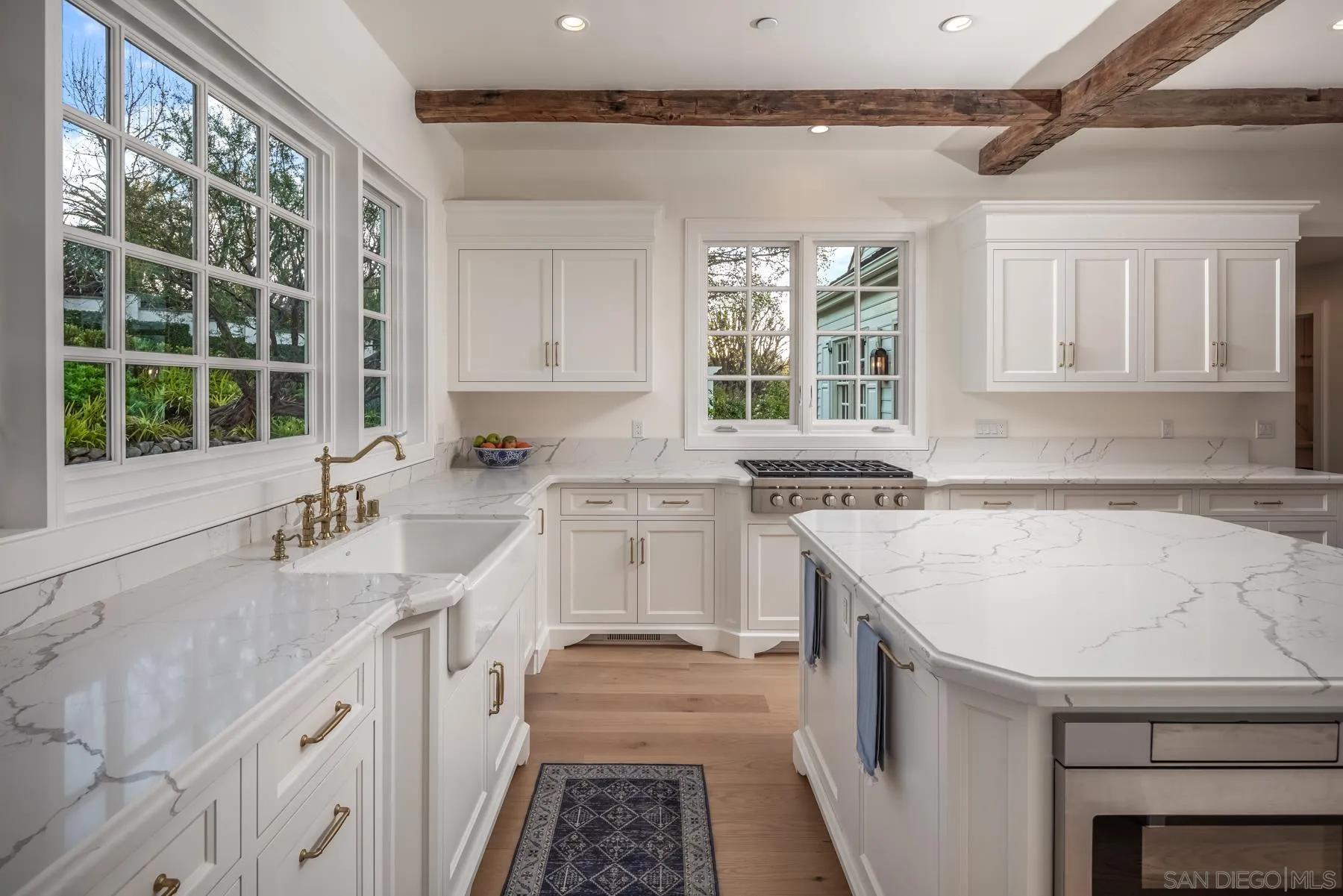 6502 Via Vista Canada Rancho Santa Fe, CA 92067 - Photo 16 of 55 a kitchen with a sink stove and cabinets