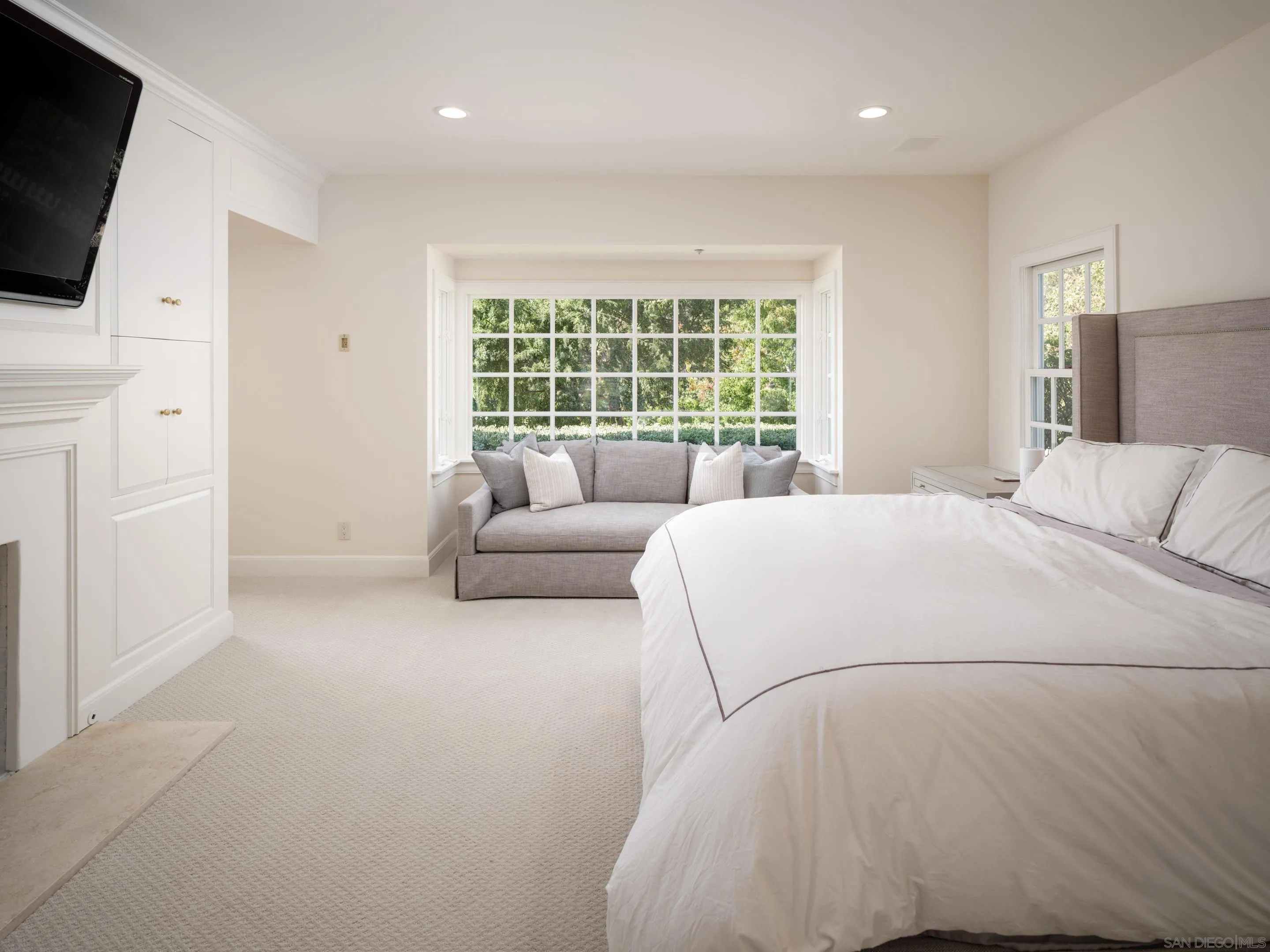 6502 Via Vista Canada Rancho Santa Fe, CA 92067 - Photo 28 of 55 a bedroom with a bed a flat screen tv and a couch