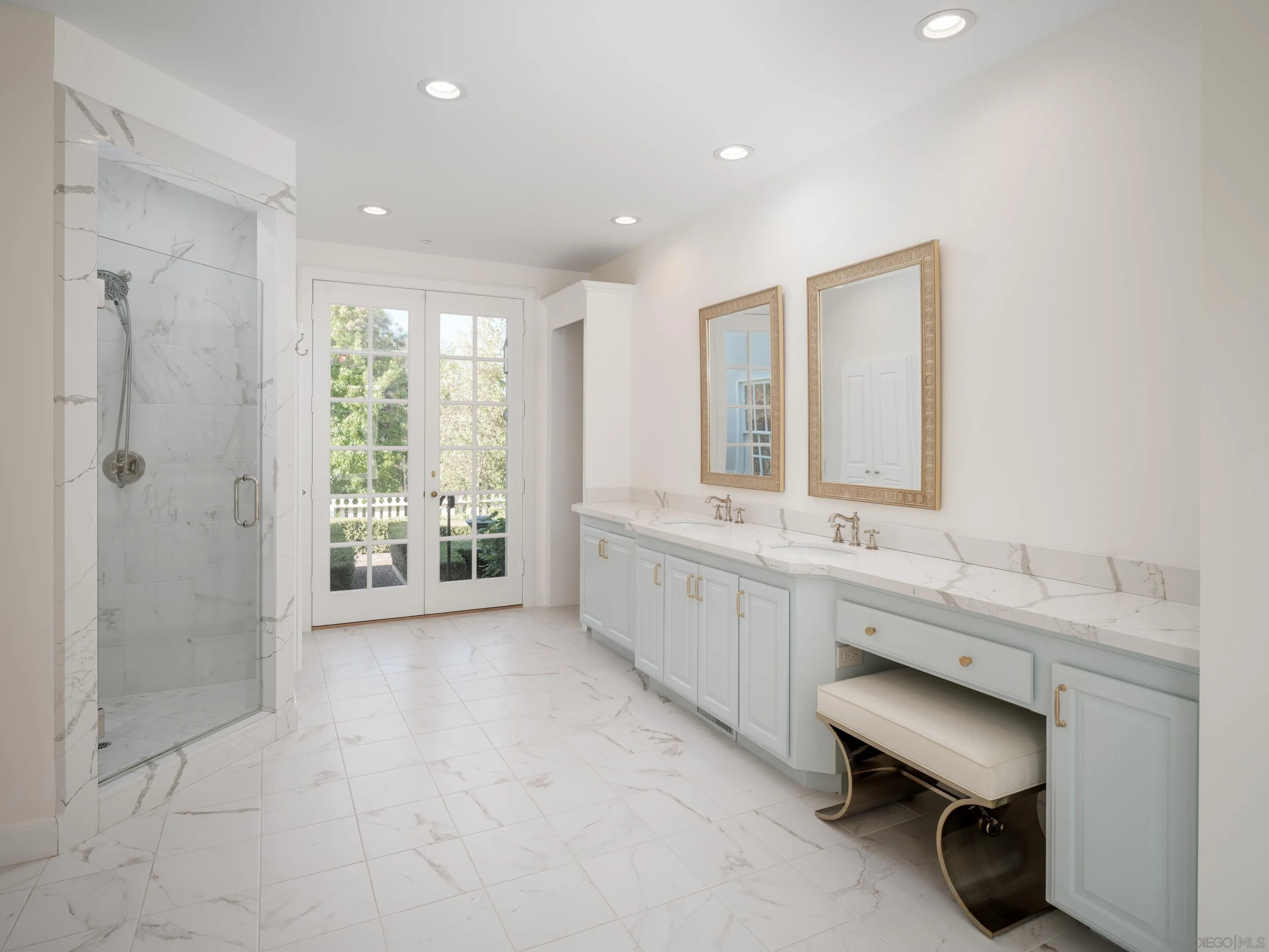 6502 Via Vista Canada Rancho Santa Fe, CA 92067 - Photo 30 of 55 a bathroom with a double vanity sink a toilet a glass door and shower