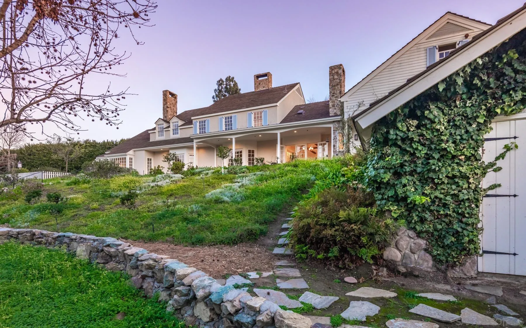 6502 Via Vista Canada Rancho Santa Fe, CA 92067 - Photo 46 of 55 a front view of a house with a yard