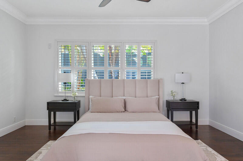 1710 Southwest 2nd Avenue Boca Raton, FL 33432 - Photo 17 of 29 a bedroom with a bed and a window