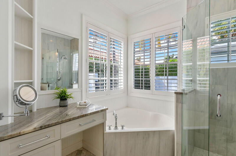 1710 Southwest 2nd Avenue Boca Raton, FL 33432 - Photo 19 of 29 a bath room with a granite countertop sink and a shower