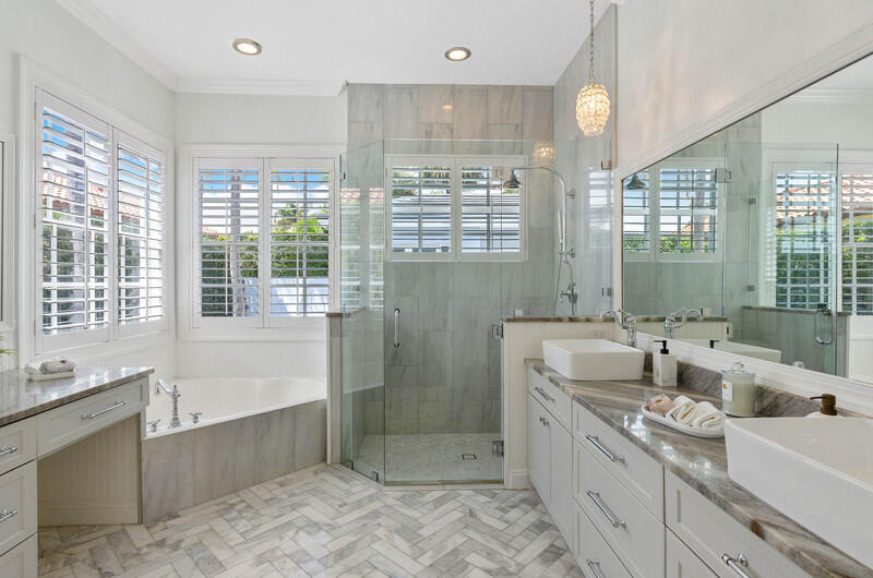 1710 Southwest 2nd Avenue Boca Raton, FL 33432 - Photo 20 of 29 a bathroom with a tub a sink and large windows