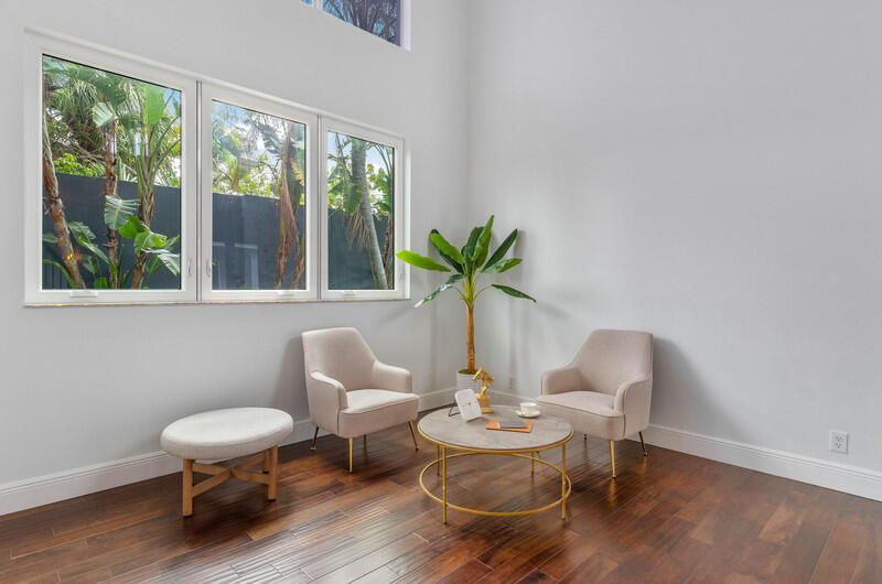 1710 Southwest 2nd Avenue Boca Raton, FL 33432 - Photo 23 of 29 a living room with furniture and a large window