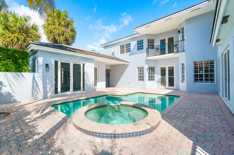 1710 Southwest 2nd Avenue Boca Raton, FL 33432 - Photo 25 of 29 a front view of a house with a yard and porch