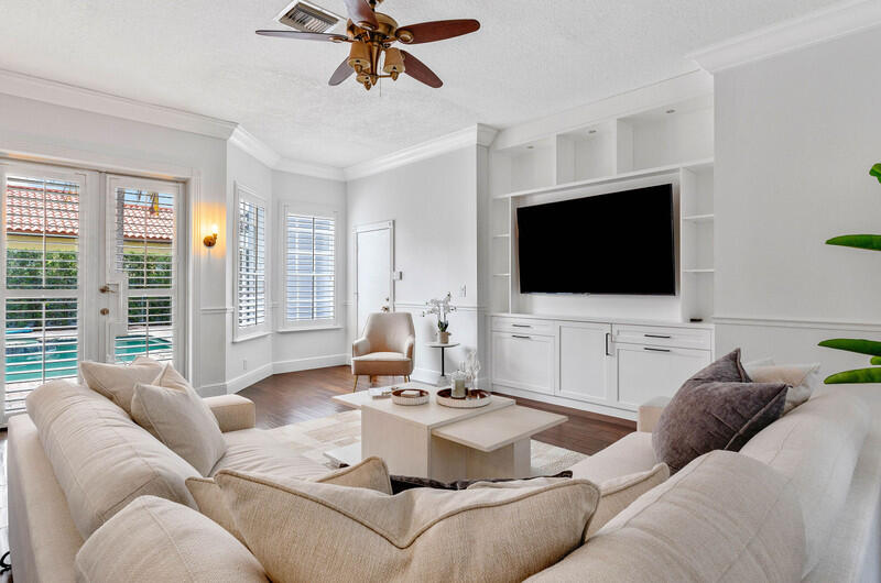1710 Southwest 2nd Avenue Boca Raton, FL 33432 - Photo 5 of 29 a living room with furniture and a flat screen tv
