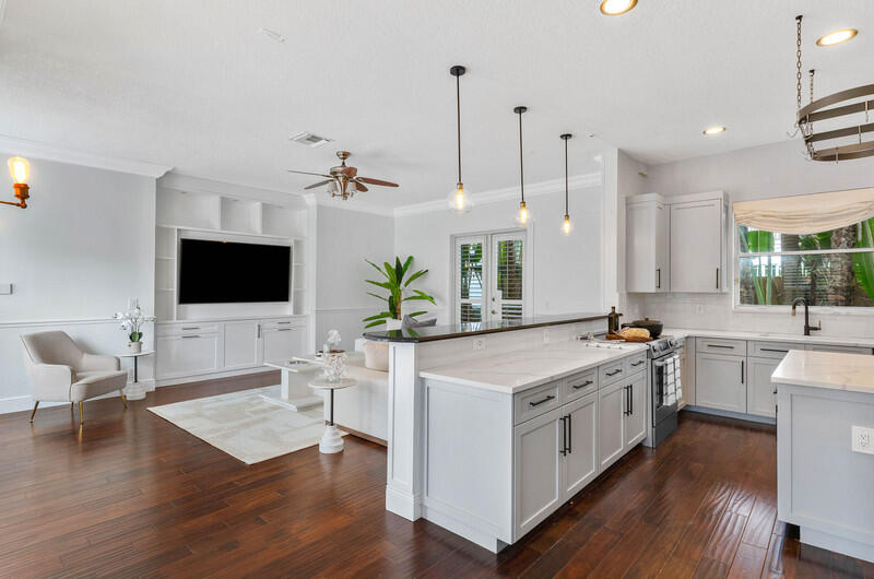 1710 Southwest 2nd Avenue Boca Raton, FL 33432 - Photo 6 of 29 a large white kitchen with a stove sitting space and wooden floor