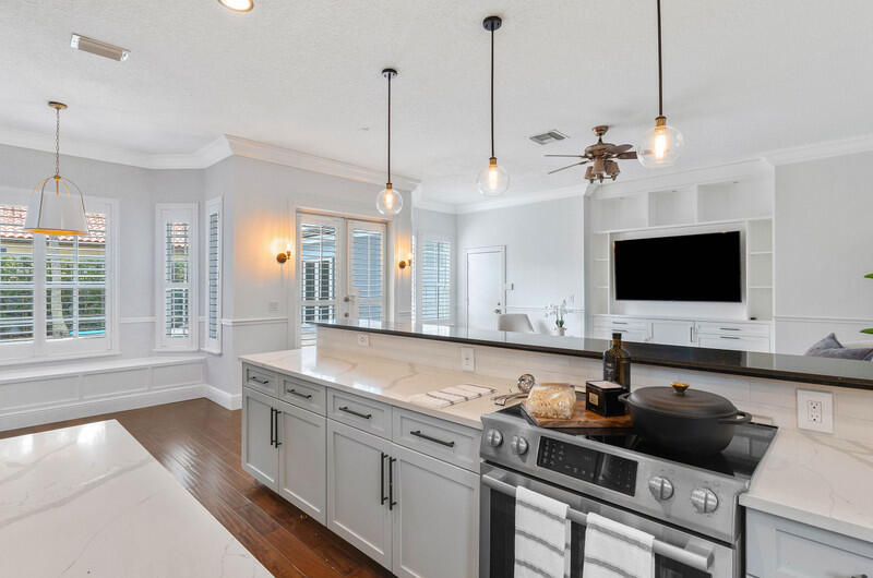 1710 Southwest 2nd Avenue Boca Raton, FL 33432 - Photo 7 of 29 a view of a kitchen with kitchen island a sink stainless steel appliances and a window