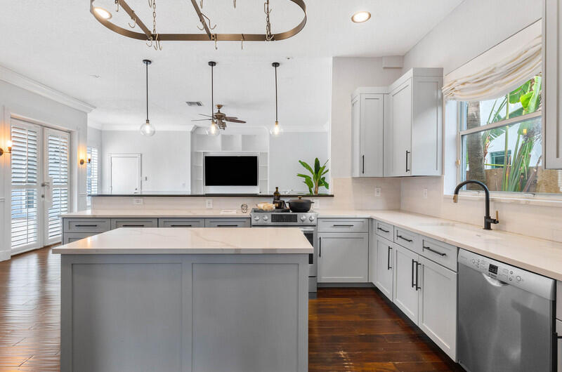 1710 Southwest 2nd Avenue Boca Raton, FL 33432 - Photo 8 of 29 a kitchen with a sink stove and cabinets