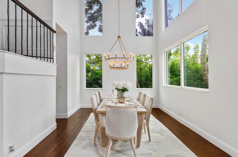 1710 Southwest 2nd Avenue Boca Raton, FL 33432 - Photo 10 of 29 a dining room with furniture a chandelier and wooden floor