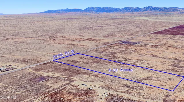 a view of an ocean beach and mountain