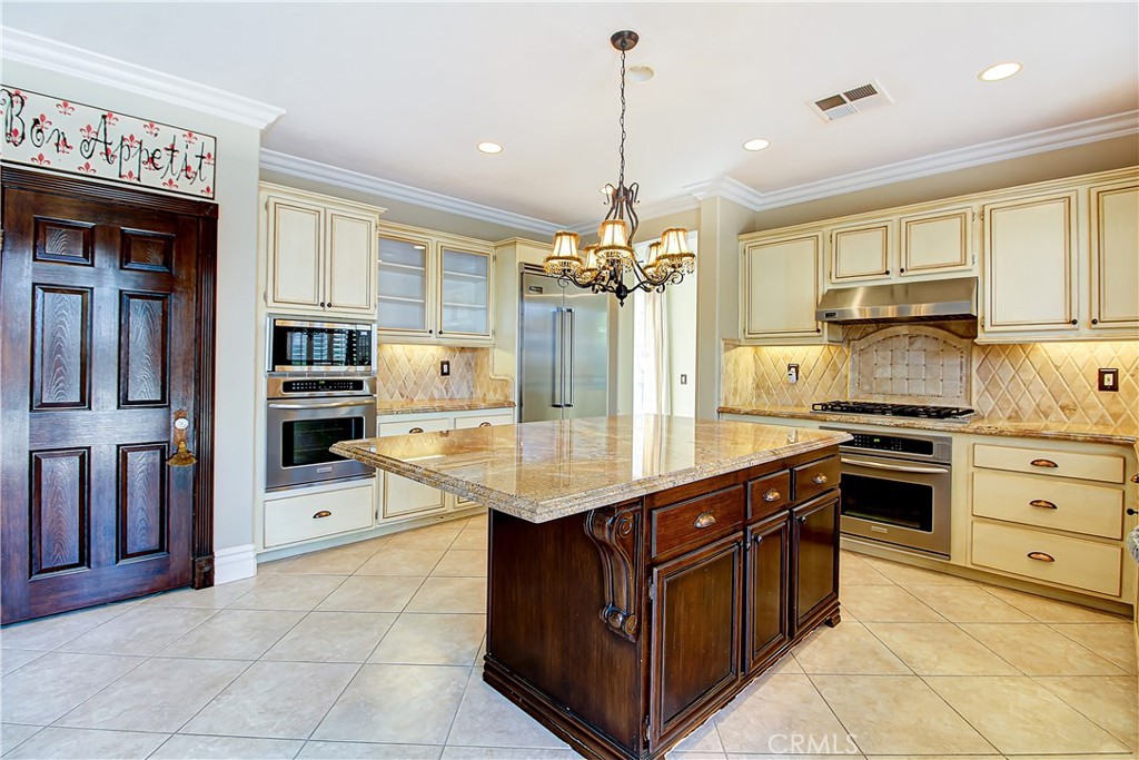 14182 Crystal View Terrace Riverside, CA 92508 - Photo 21 of 74 a kitchen with stainless steel appliances granite countertop a stove oven and a refrigerator