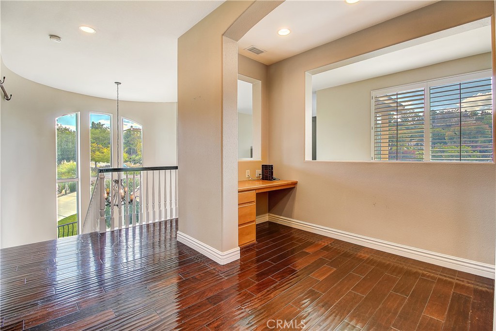14182 Crystal View Terrace Riverside, CA 92508 - Photo 37 of 74 a view of a room with wooden floor and a window