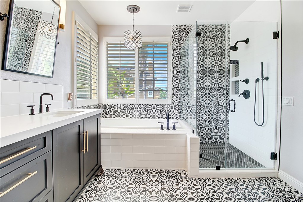 14182 Crystal View Terrace Riverside, CA 92508 - Photo 46 of 74 a bathroom with a shower sink and mirror