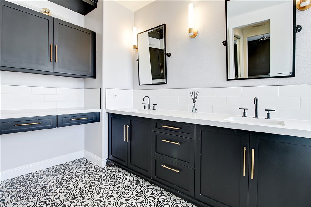 14182 Crystal View Terrace Riverside, CA 92508 - Photo 48 of 74 a bathroom with a sink and a mirror