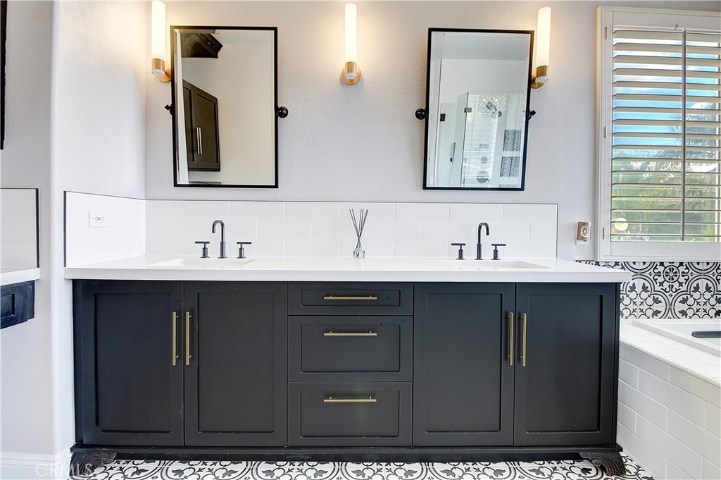 14182 Crystal View Terrace Riverside, CA 92508 - Photo 49 of 74 a bathroom with a sink vanity and mirror