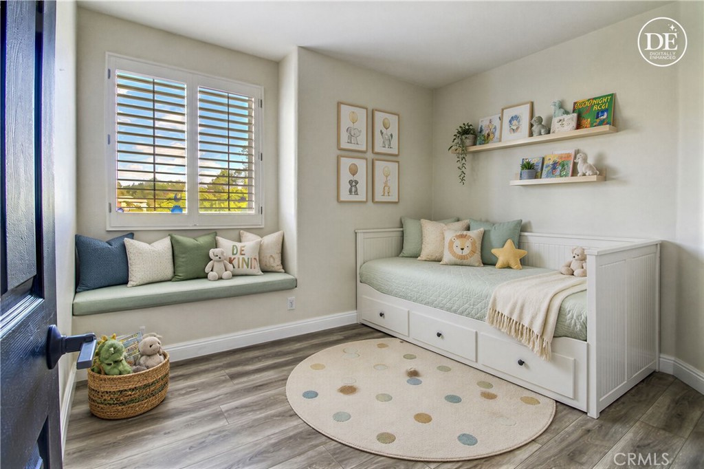14182 Crystal View Terrace Riverside, CA 92508 - Photo 56 of 74 a bedroom with a bed and wooden floor