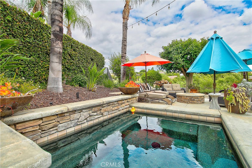 14182 Crystal View Terrace Riverside, CA 92508 - Photo 60 of 74 a view of a patio with chairs and umbrellas