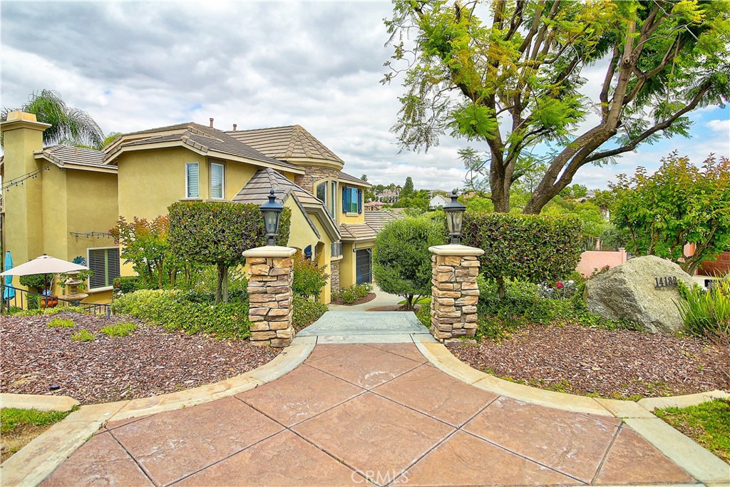 14182 Crystal View Terrace Riverside, CA 92508 - Photo 9 of 74 a front view of a house with garden