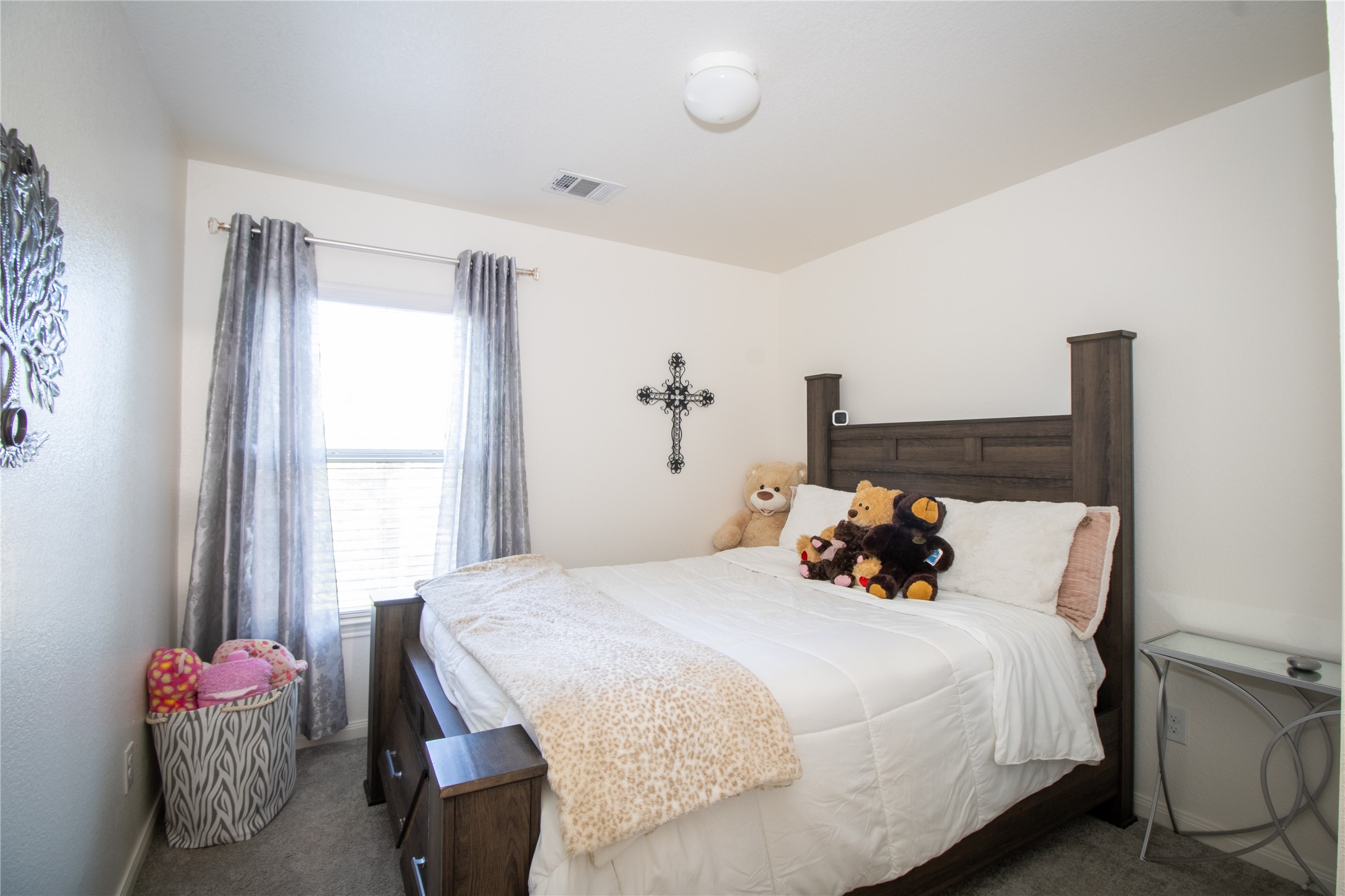 15583 Arrowhead Loop West Willis, TX 77378 - Photo 16 of 21 a bedroom with a bed and a window