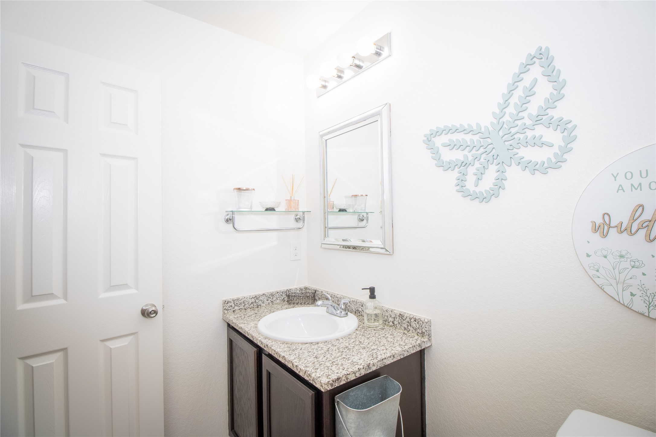 15583 Arrowhead Loop West Willis, TX 77378 - Photo 17 of 21 a bathroom with a granite countertop sink and a mirror