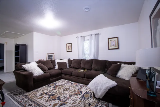 a living room with furniture and a couch