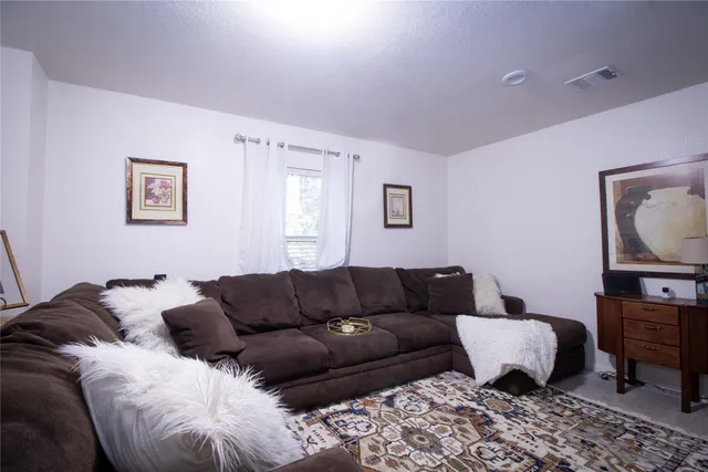 a living room with a couch and a couch