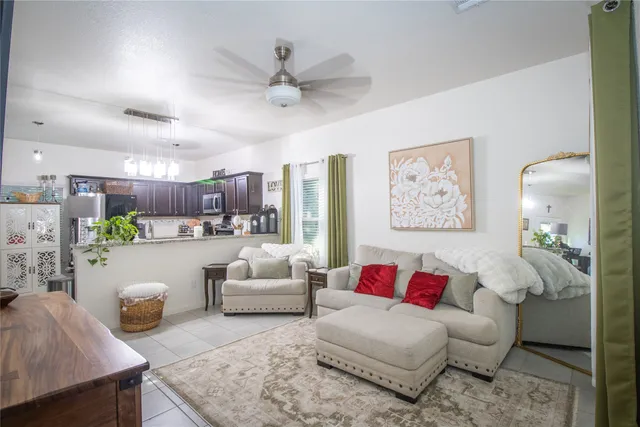 a living room with furniture and a large window