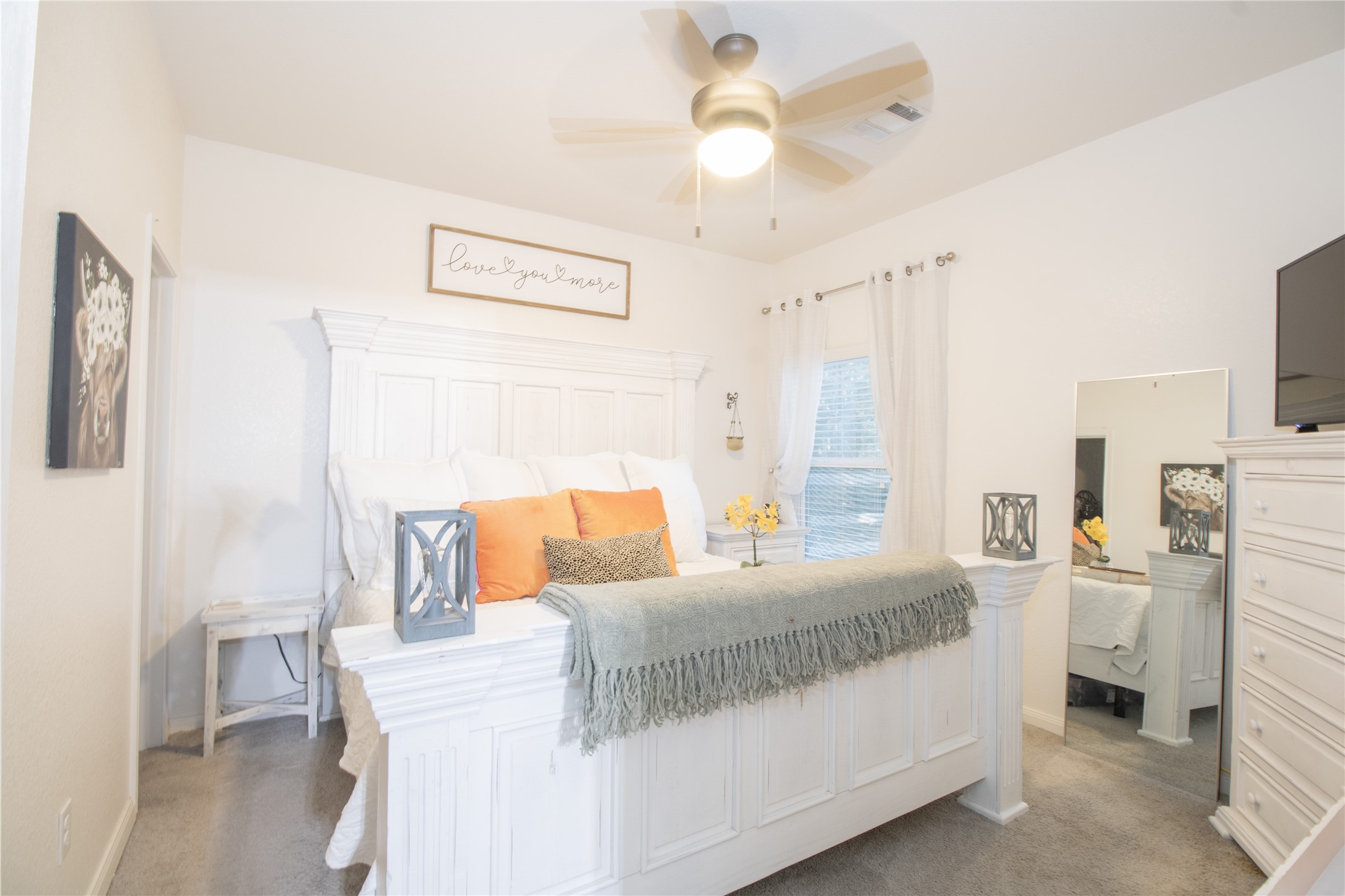 15583 Arrowhead Loop West Willis, TX 77378 - Photo 8 of 21 a bedroom with a bed and a chandelier