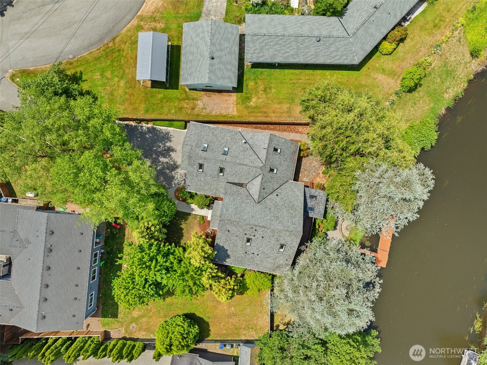 an aerial view of a house with a yard