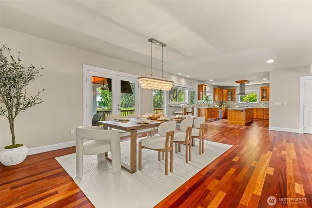 a kitchen with stainless steel appliances granite countertop a sink and wooden cabinets