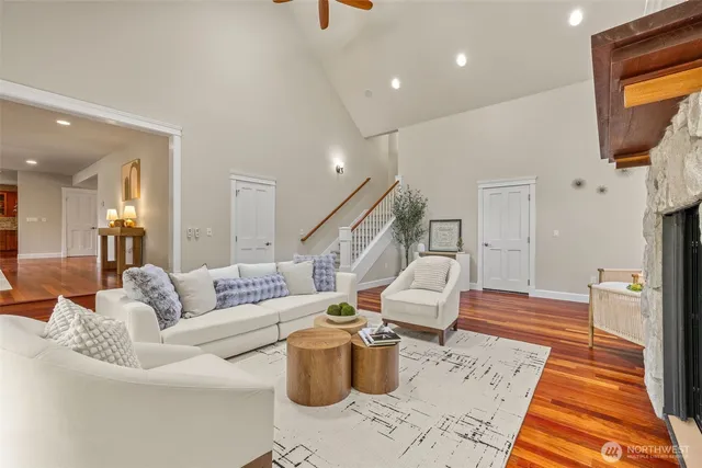a living room with furniture and a potted plant