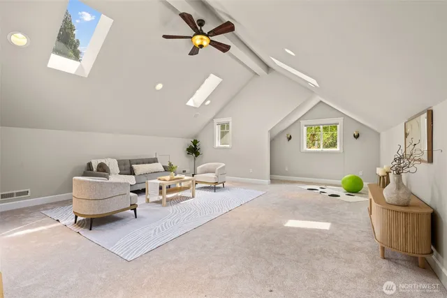 a bedroom with furniture and a potted plant