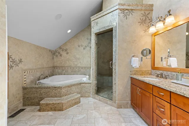 a bathroom with a bathtub and shower