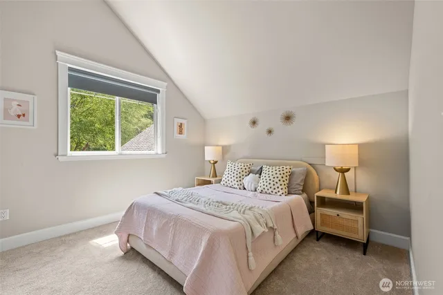 a bathroom with a granite countertop sink a toilet and shower