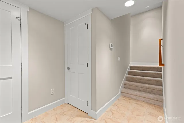 a kitchen with stainless steel appliances granite countertop a refrigerator and wooden cabinets