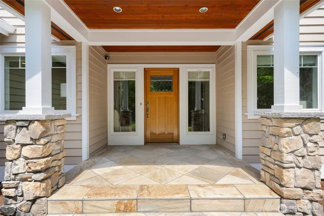 front view of a brick house with a large window