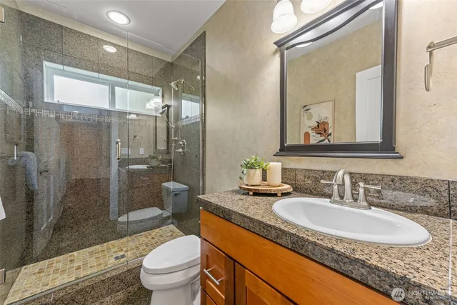 a bedroom with a bed and a couch