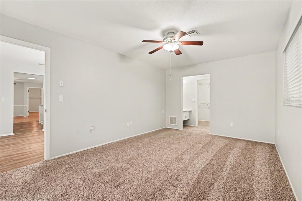 8103 Roxboro Drive Hudson, FL 34667 - Photo 11 of 28 a view of empty room with wooden floor