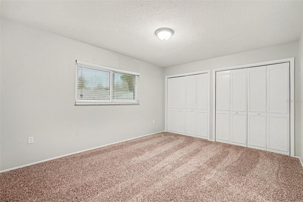 8103 Roxboro Drive Hudson, FL 34667 - Photo 24 of 28 a view of an empty room with a window