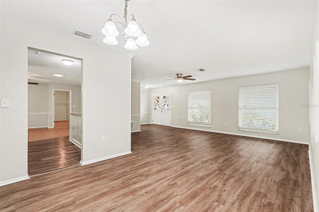8103 Roxboro Drive Hudson, FL 34667 - Photo 5 of 28 a view of a room with wooden floor and window