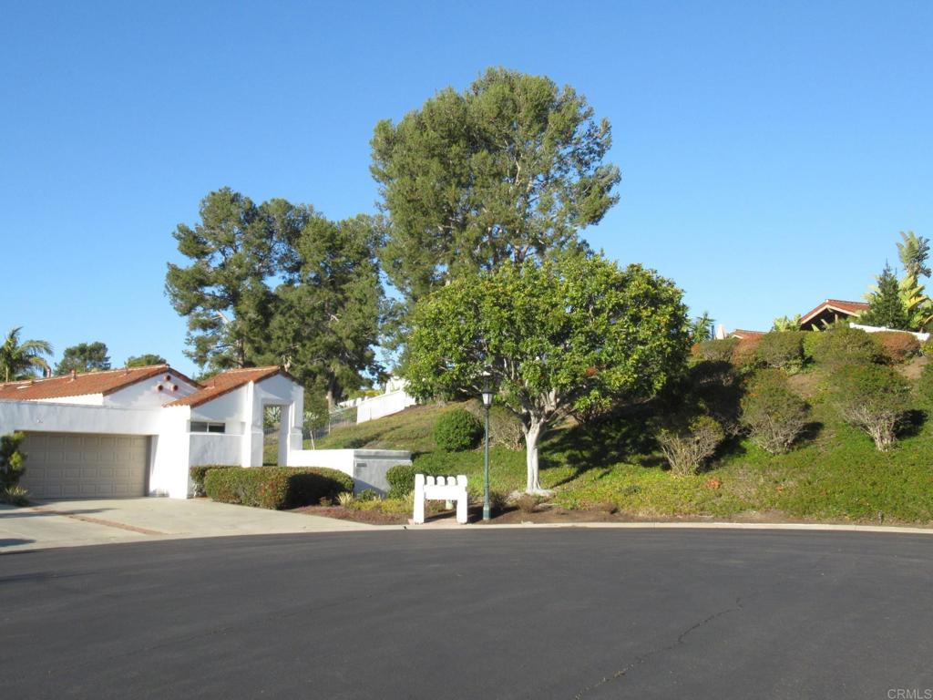a view of a house with a street