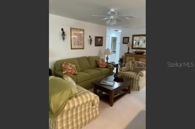 a bedroom with a bed and painting on the wall