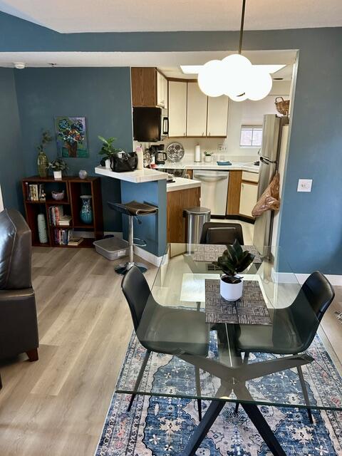 2700 Lawrence Crossley Road, Unit 18 Palm Springs, CA 92264 - Photo 7 of 7 a view of a dining room with furniture