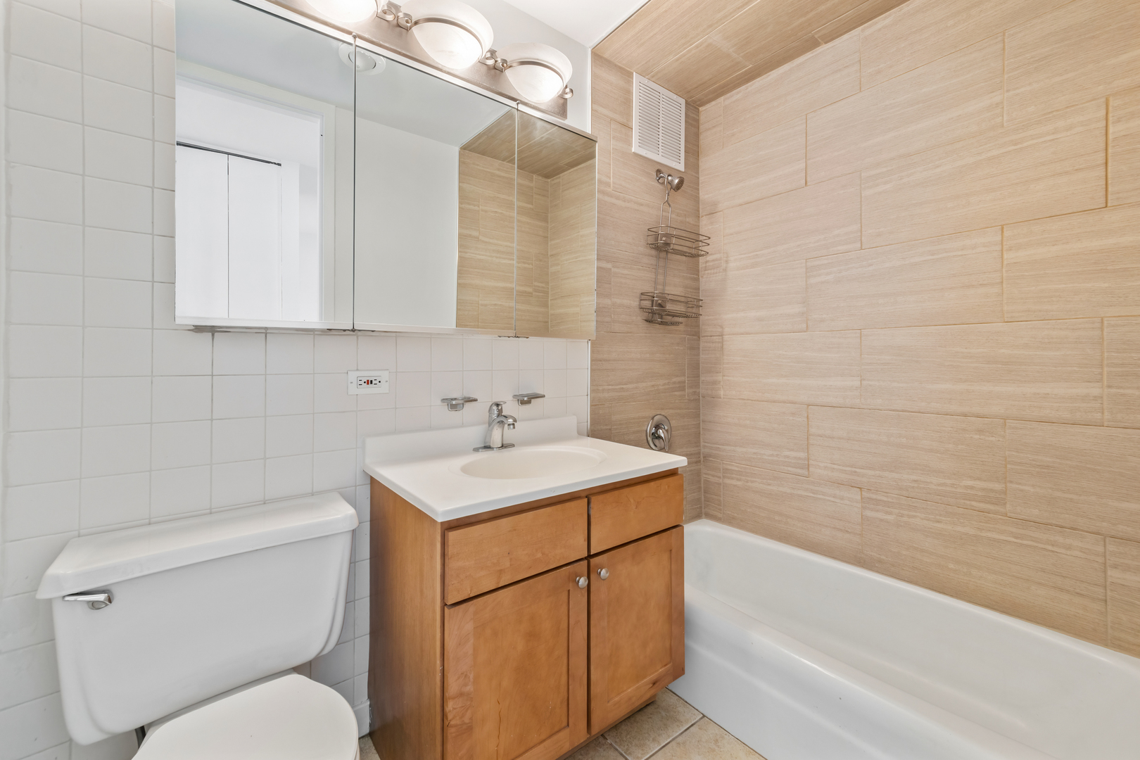 655 West Irving Park Road, Unit 4808 Chicago, IL 60613 - Photo 12 of 26 a bathroom with a sink a toilet and bathtub