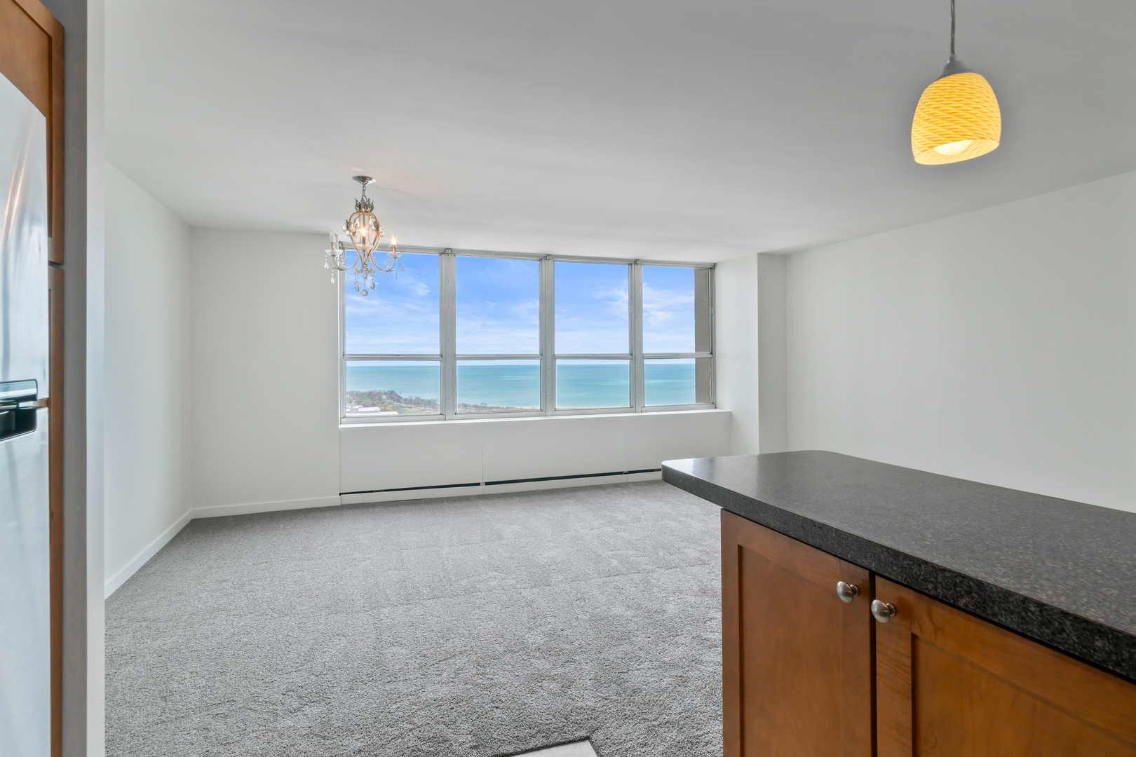 655 West Irving Park Road, Unit 4808 Chicago, IL 60613 - Photo 9 of 26 a view of an empty room with a window