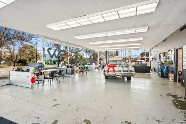 a living room with lots of furniture and clutter