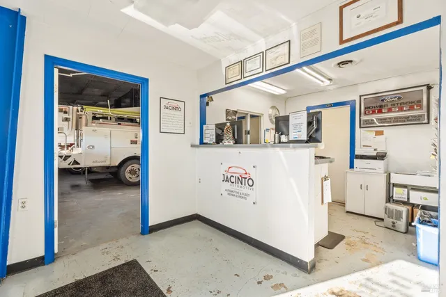 a view of livingroom with furniture and refrigerator